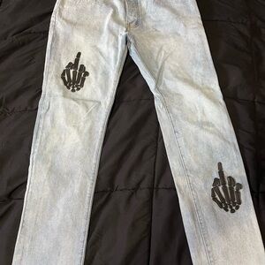 MNML Light Blue Relaxed Jeans with Black Skeleton Design